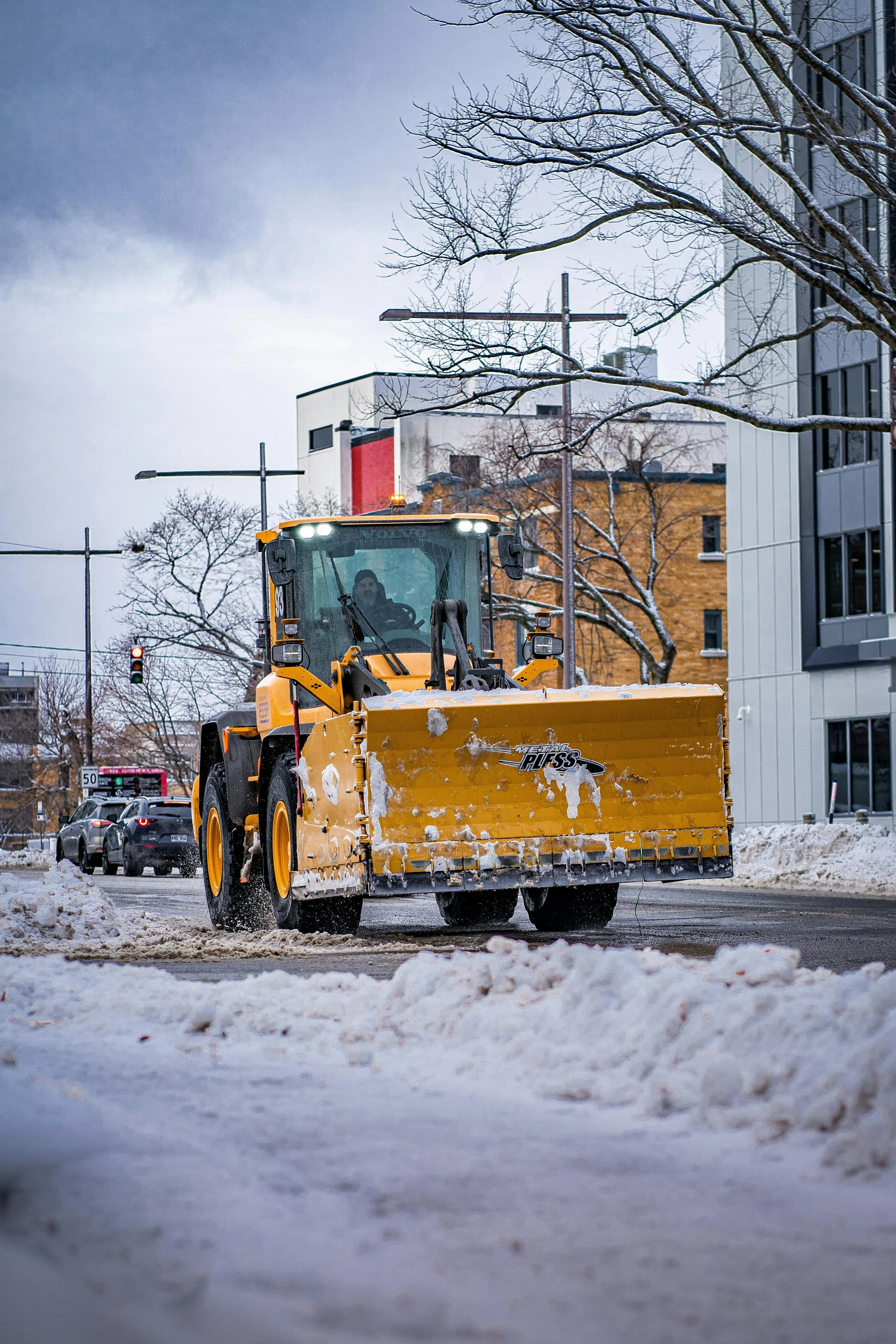 man plowing snow