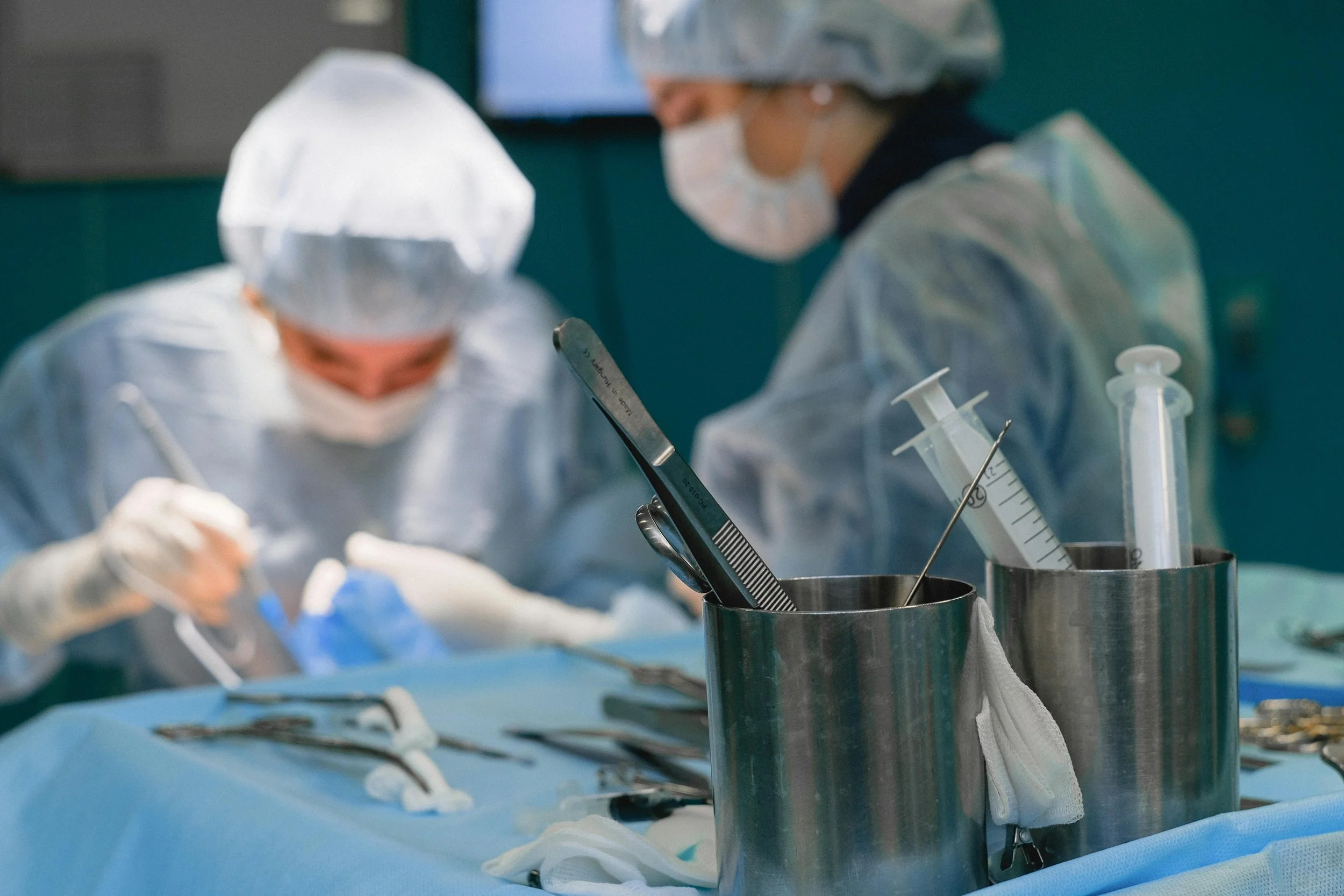 health care workers performing surgery