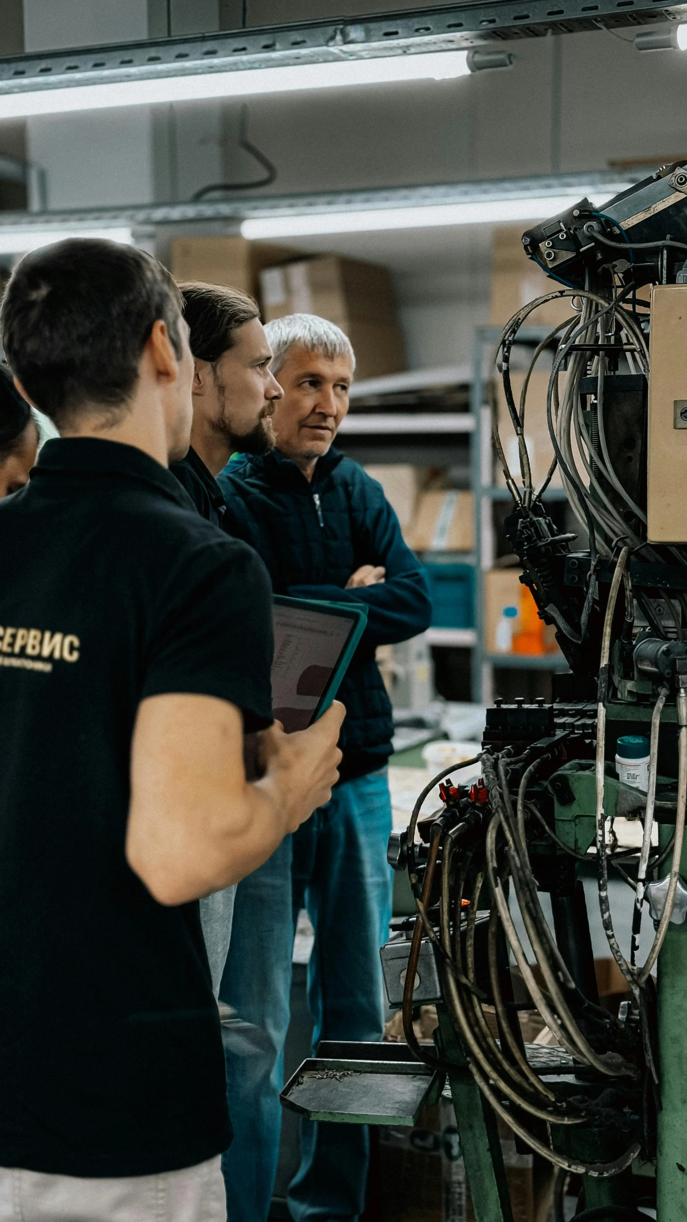 technicians checking a machine