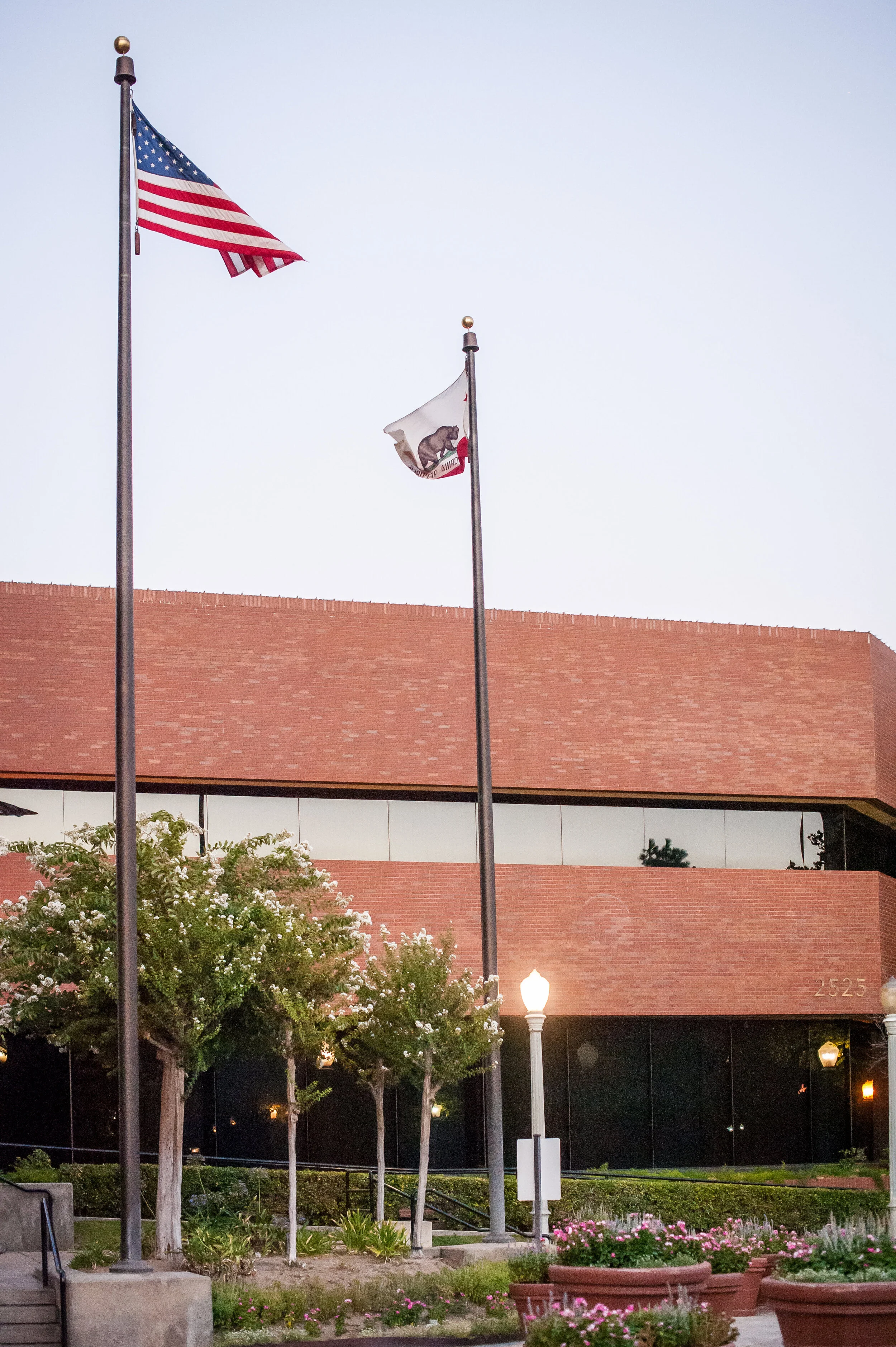 the American and California flags in front of the Cole Fisher building